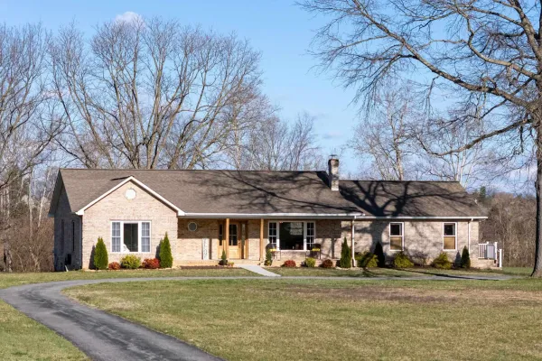 Front of 901 Riverside Ave, a brick ranch home on 1.5 acres in Grottoes, Virginia