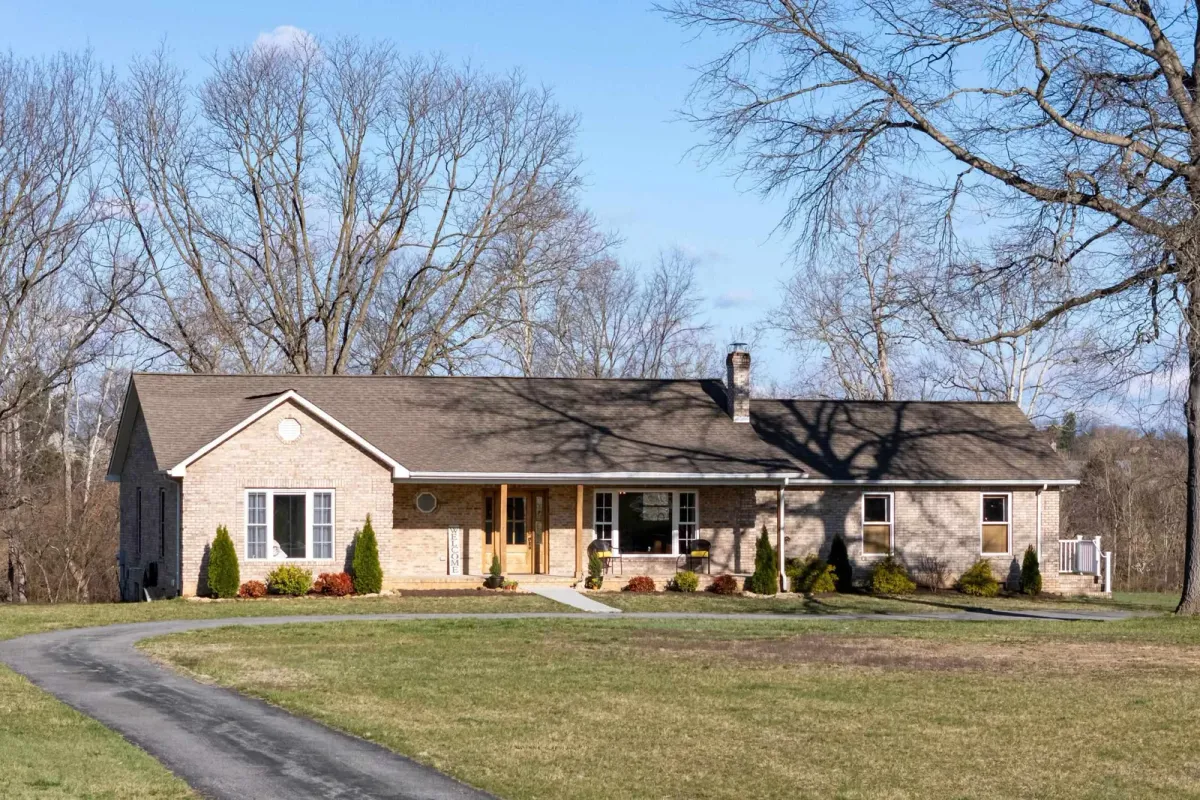Front of 901 Riverside Ave, a brick ranch home on 1.5 acres in Grottoes, Virginia