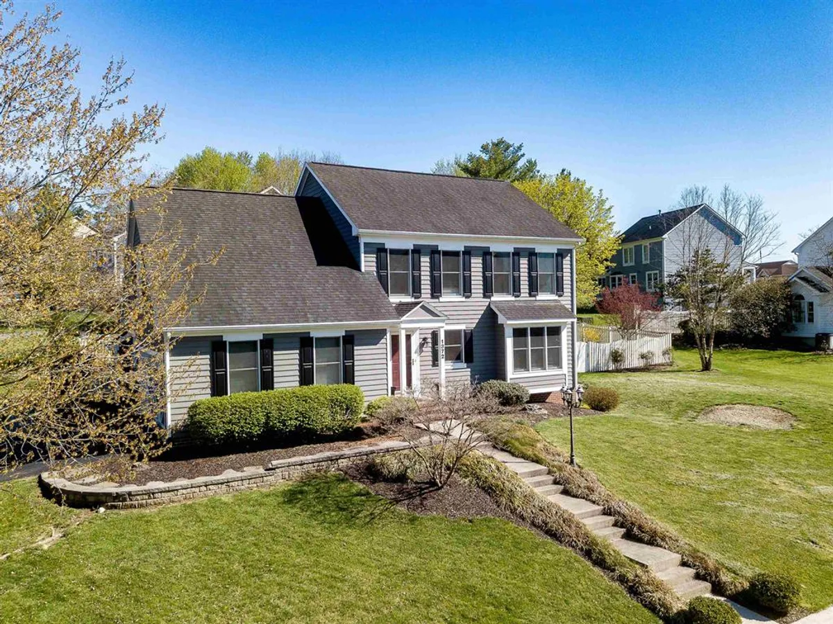 Colonial home with landscaped yard on elevated lot in Sunset Heights, Harrisonburg VA