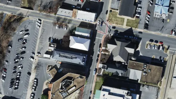 Aerial view of the 100 block of North Main Street in downtown Harrisonburg, with the three-story building at 181 N Main St in the center