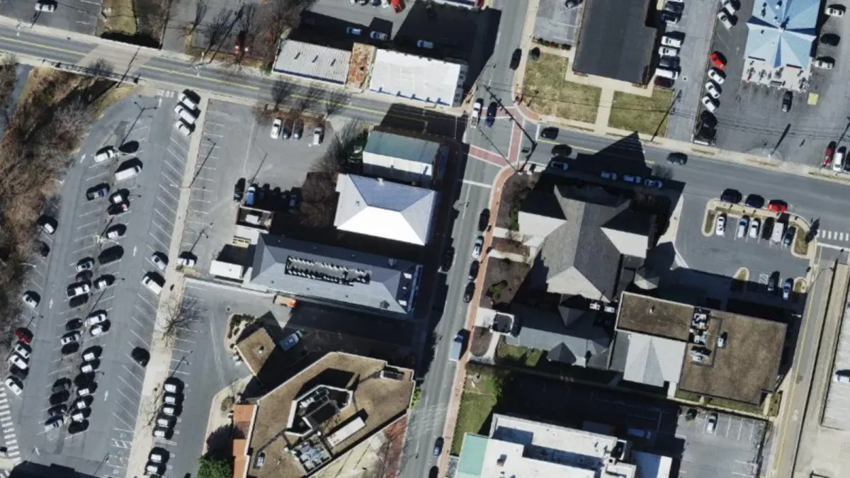 Aerial view of the 100 block of North Main Street in downtown Harrisonburg, with the three-story building at 181 N Main St in the center