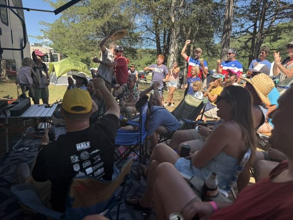 Around 50 festival-goers gathered to watch the U.S. soccer match on a projector at our campsite