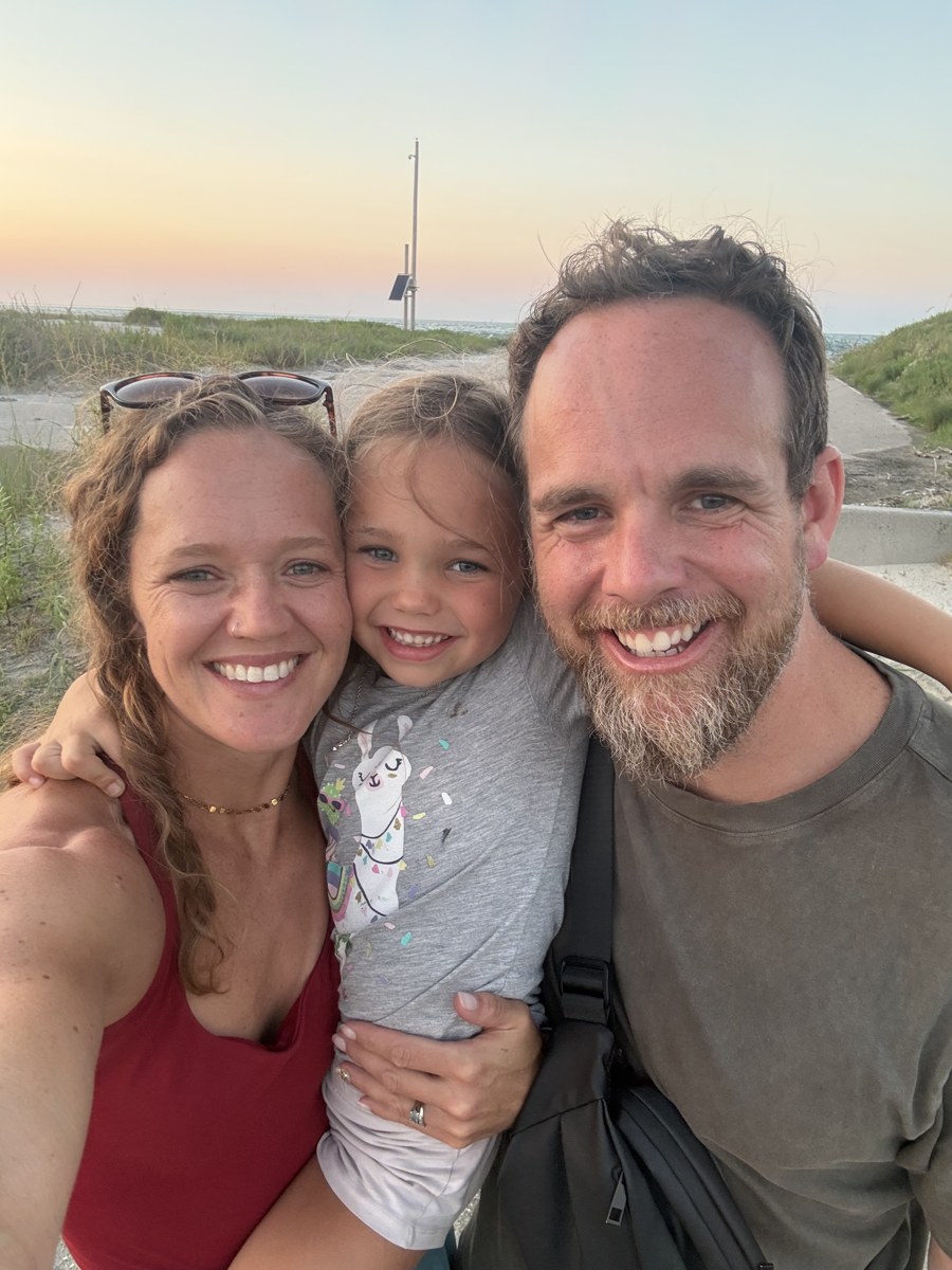 Family selfie at sunset on the beach path